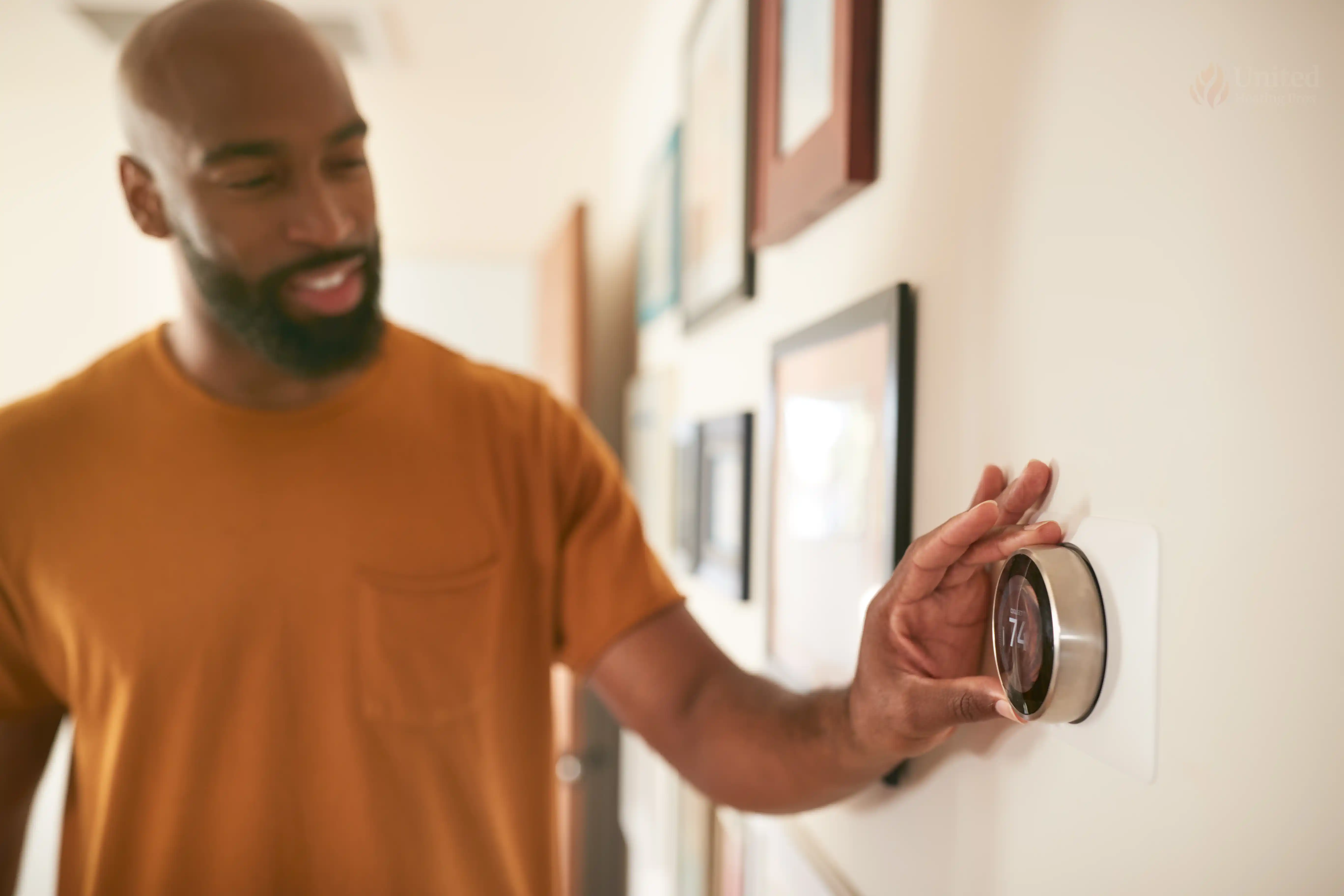 Person adjusting home thermostat